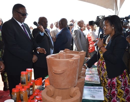 President Peter Mutharika listens as Dorothy Tembo-Nhlema briefs him on Energy efficiency stove at the launch of the Malawi Parliamentary Conservation Caucus at parliament building-pic by Govati Nyirenda