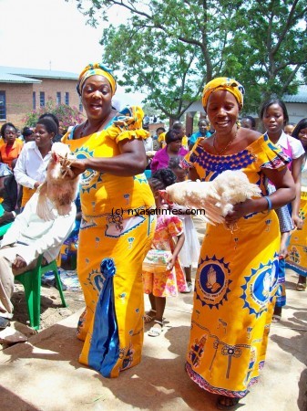 Catholic women presenting their gifts