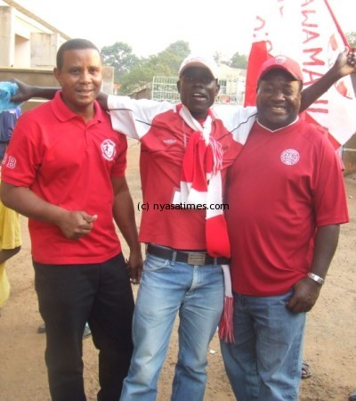 Bullets assistant coach (L) and Bullets head coach Ng'onamo (R) posing with a supporter after the match (1)