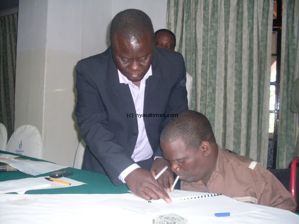 VAAM President Chrisford Chayera signing the agreement