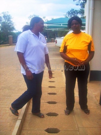 Malawi Queens Under 20 Coach Connis Mhone sharing notes with her Manageress Judith Chalusa