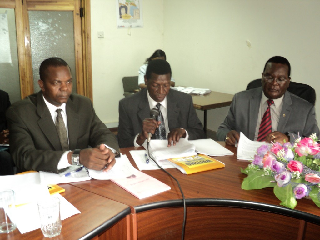 Commissioner Bishop Malango franked by Commisioner Stanlel Billiati (centre) and HarrisPotani (left).