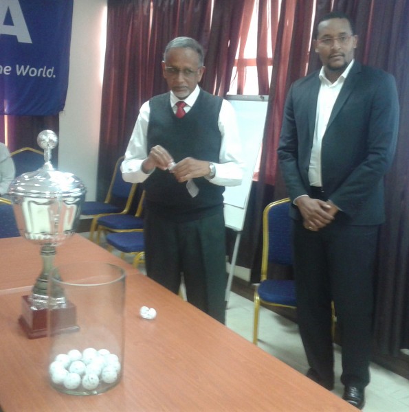 Sports Council board member Khrishna Achutan (left) and Sulom vice-president Daud Suleman conducting the draw