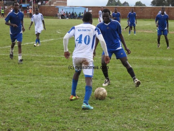 4-goal hero Balaka tries to dribble past a Dowa defender