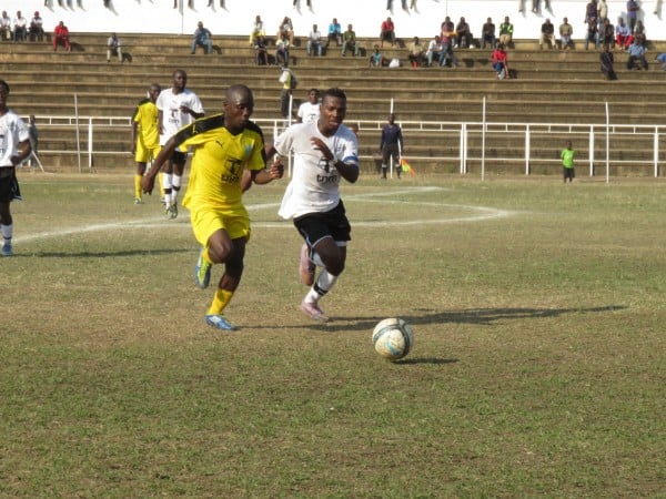 50-50- A KB player & Fisd opponent go for the ball, Pic Alex Mwazalumo