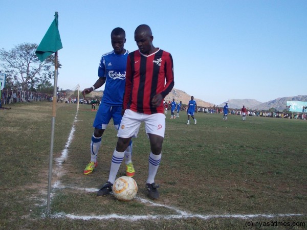 A Chinamwali striker shielding the ball away from Kaipa.....Photo Jeromy Kadewere/Nyasa Times