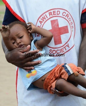 A medic takes care of a child found wandering aimlessly at Sammy's Relief Camp in Chikwawa District, near Blantyre, Malawi. (Thoko Chikondi, AP)