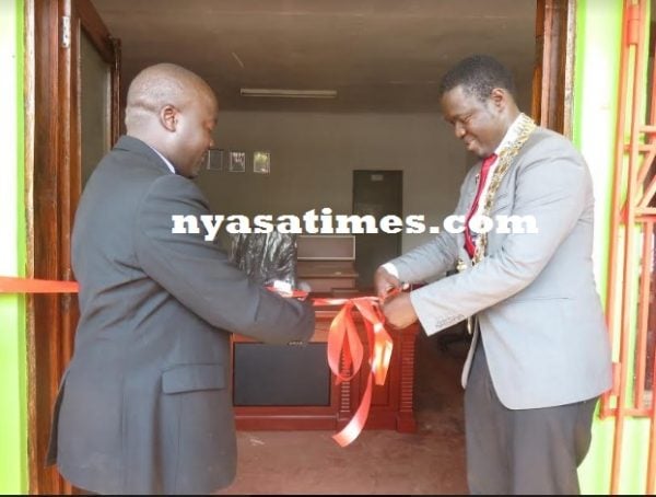 Mkandawire cuts a ribbon during the official opening.