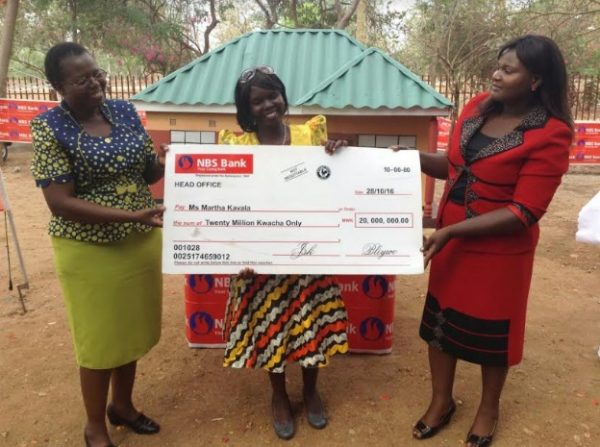 Kavala receiving the cheque from NBS's Mandoloma (right)