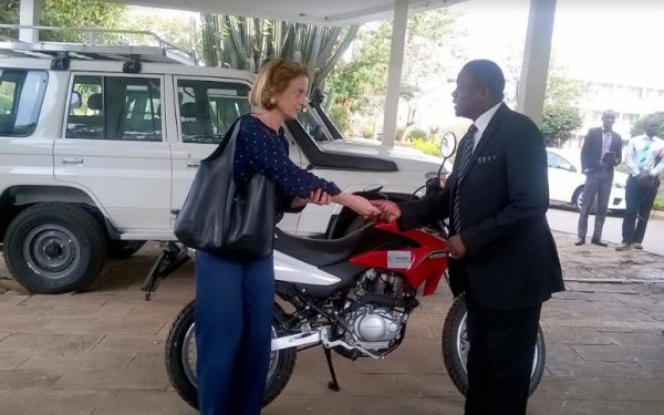 Kumwembe (R) receives car keys