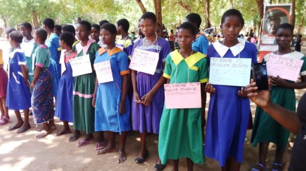 Nsanje Female learners with posters showing some of the problems they face in the community during the functin