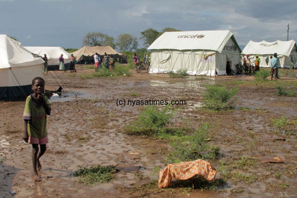 A displaced child walks through the mud at the Nchalo camp for flood refugees.