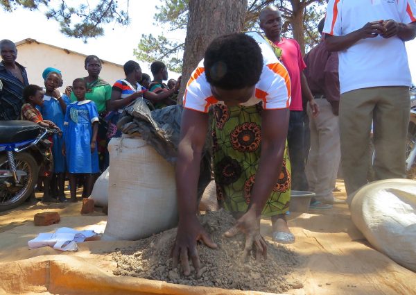 A farmer showing man made fertilizer during the field  visit....Photo Jeromy Kadewere.