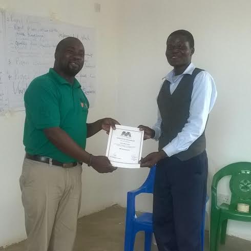 A participant being awarded at a previous training