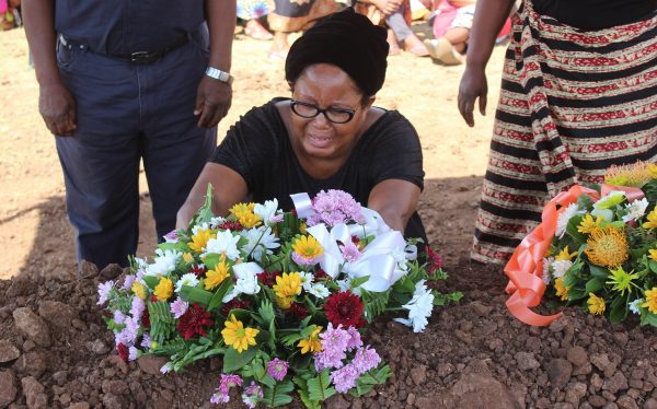 A woman in tears as she lays her wreath -.Photo Jeromy Kadewere