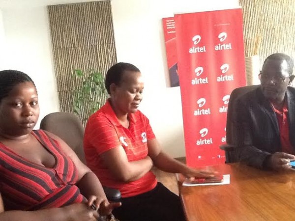 Airtel Public Relations Manager Edith Tsilizani mingles with winners