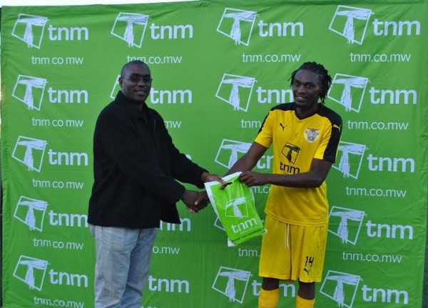 Alfred Lungu from Sulom awarding Patrick Thupi the man of the match...Photo Jeromy Kadewere