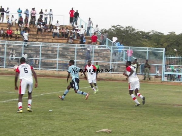 Pavuta! All in vain- Scorer Ignatious Makoloni (24) goes for the ball against Blantyre Unt on Saturday