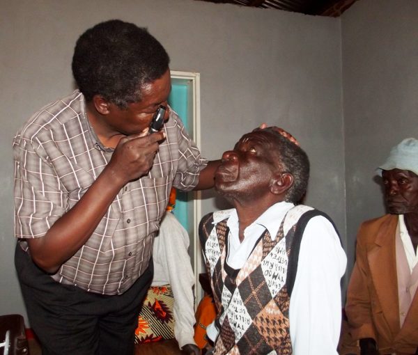 An eye specialist examines one of the patients Pic By Kondwani Magombo