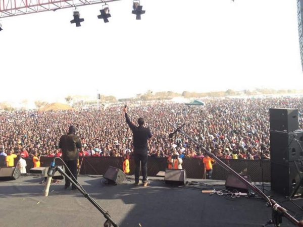 Andrew Palau preaching to thousands of Malawians