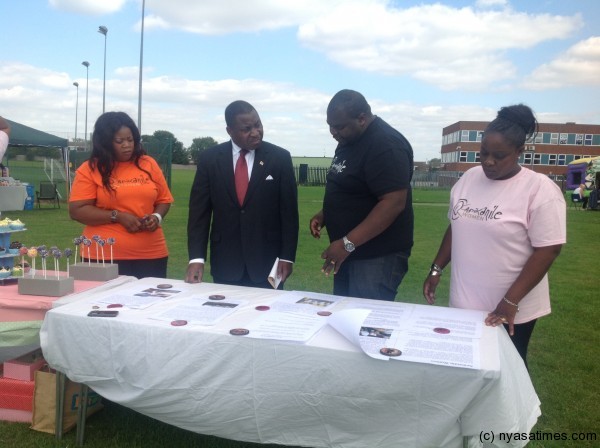 The ambassador with Apikanile coordinator Wycliffe Nyatsambo, (in black) and Apikanile women group founders; Gertrude Banda left (in Orange) and Towera Gondwe-Nyatsambo right (in pink)