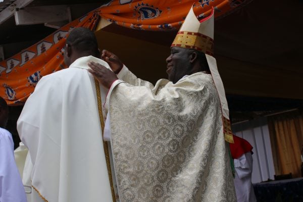 Archbishop Thomas Msusa dressing one of the priests...Photo Jeromy Kadewere