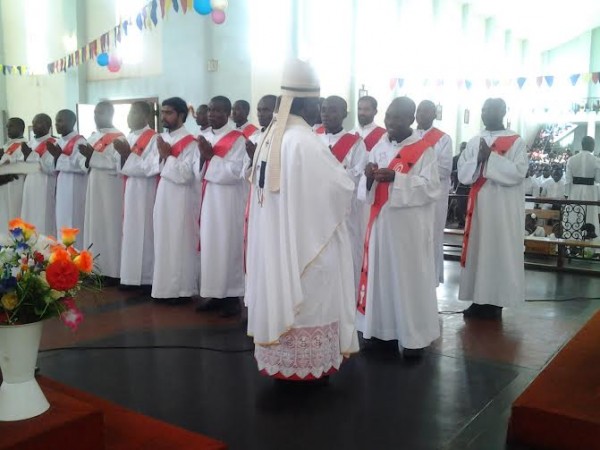 Archbishop Thomas Msusa ordaning the seminarians