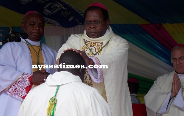 Archbishop Ziyaye laying his hands on the consecrated Bishop...Photo Jeromy Kadewere