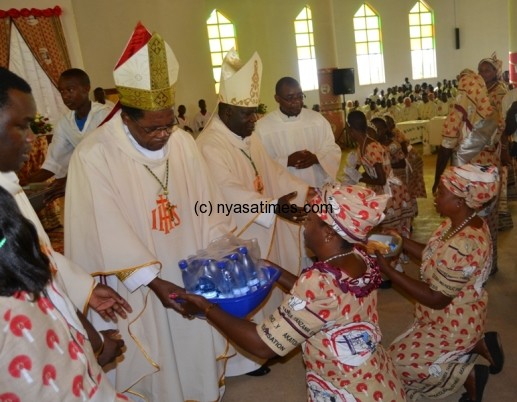 Archbishop Ziyaye receives the offerings at DonBosco Parish at Area 23  in Lilongwe-Pic. by Abel Ikiloni.-Pic. by Abel Ikiloni