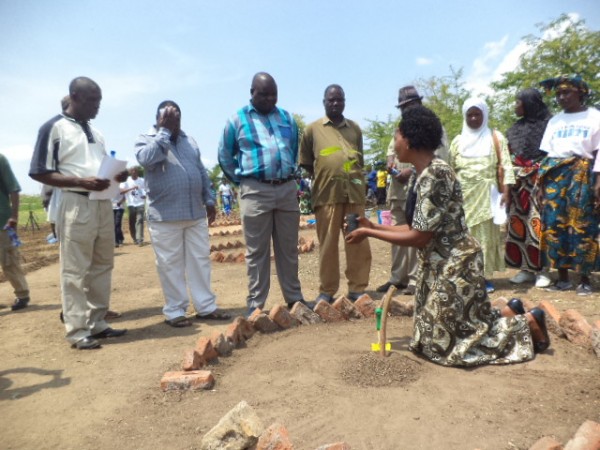 Assistant District Forestry Officer for Mangochi, Mary Kamanga demonstrating how the trees are supposed to be planted before the  launch. Pic Arnold Namanja (MANA)
