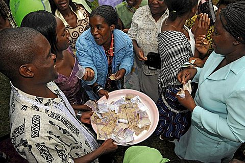At a traditional Malawian engagement (chinkhoswe) the guests give many low denomination notes in a dance (pelekani pelekani)