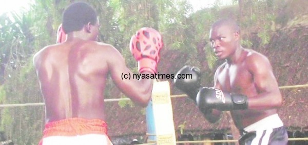 Mwamaso (left) during te bout with Tanzanian