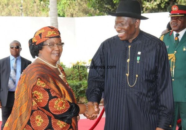 Banda welcomed by Nigerian President Goodluck Jonathan at the Abuja International Conference Centre on Thursday -- Pic by Joseph Josiah.