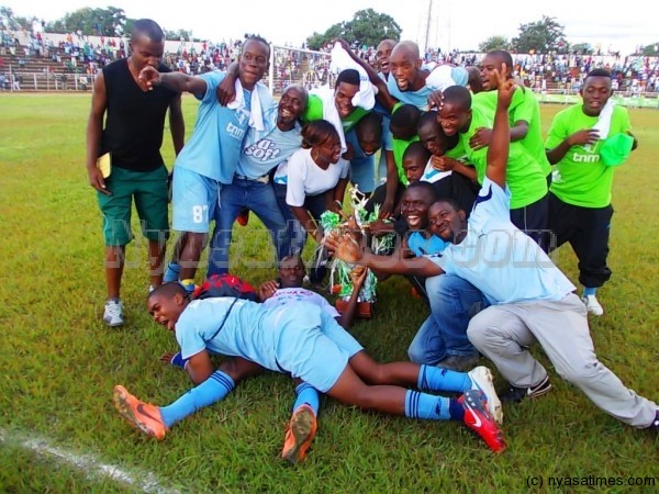 Party mood: Silver Strikers celebrate their title winning