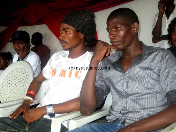 Big Bullets and Flames players George Nyirenda (left) and Owen Chaima following the proceedings