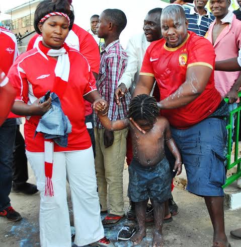 Big Bullets fans takes celebration to another level as they bath in milk..Photo Jeromy Kadewere