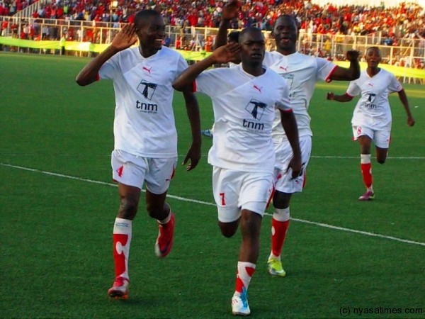 Big Bullets scorer Douglas Chirambo celebrating his goal as James Chilapondwa and Heston Munthali hepls him......Photo Jeromy Kadewere/Nyasa Times