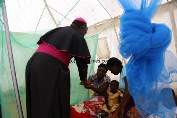 Bishop Msusa in a Camp with a Victim