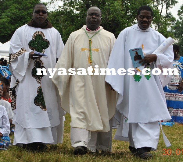 Bishop Tambala ( centre) to the altar .....Photo Jeromy Kadewere