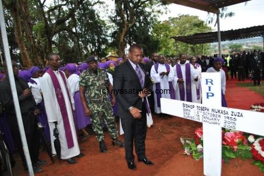Vice President Saulos Chilima paying his last respects to  Bishop Zuza after laying a wreath-Pix By Joel Chirwwa