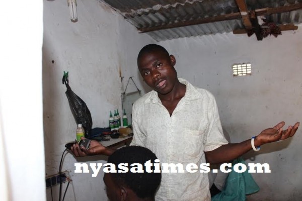 Blackout hits barber while he was shaving a a customer at Manase...Photo Jeromy Kadewere