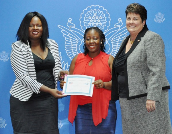 Blantyre Newspapers Ltd's Josephine Chinele shows off her Investigative Journalism certificate flanked by Palmer (r) and Sundu (l)  Pic. Courtesy of US Embassy in Malawi