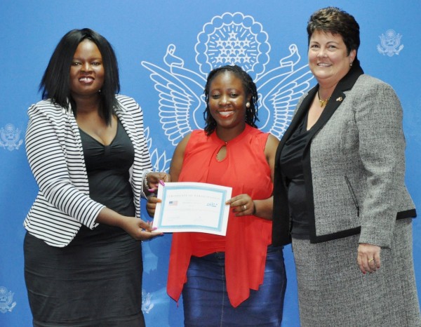 Blantyre Newspapers Ltd's Josephine Chinele shows off her Investigative Journalism certificate flanked by Palmer (r) and Sundu (l) Pic. Courtesy of US Embassy in Malawi