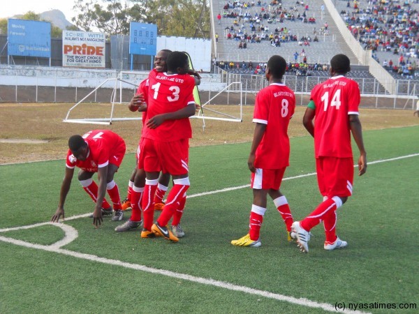 Blantyre United players celebrating a goal....