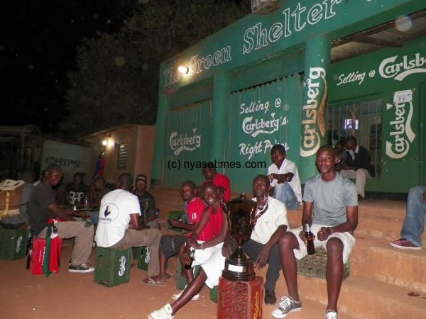 Bonkiri players captured with the trophy at Green Shelter pub later in the evening