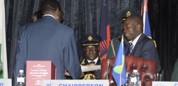 Bonnex Julius recieves his award from President Robert Mugabe - Pic courtesy of SADC