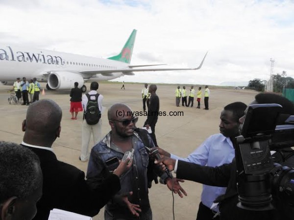 Brastus Msiska speaking to journalists at Chileka Airport after landing from Johannesburg- Pic Lucky Mkandawire