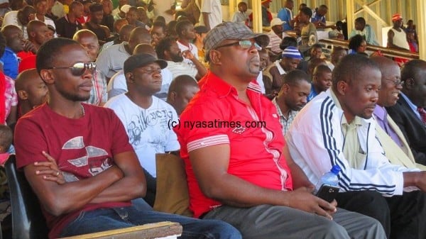 Bullets chairman Kondi Msungama and officials watch the game