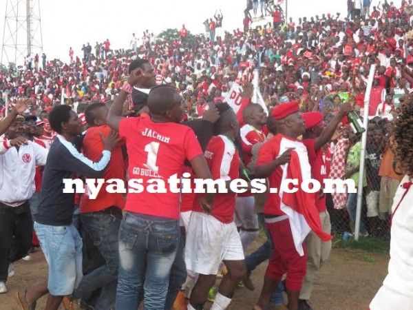 Bullets coach Mabvuto Lungu lifted by players, fans after the match, Pic Alex Mwazalumo