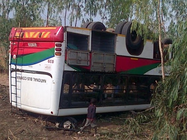 Bus overturns